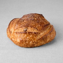 Petit pain issu d'une farine de blé blanche aux graines de courges non moulé au pur levain naturel