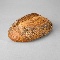 Grand pain issu d'une farine de blé complète non moulé multigraines au pur levain naturel