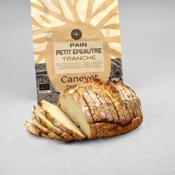 Pain petit épeautre au pur levain naturel tranché avec packaging en arrière plan